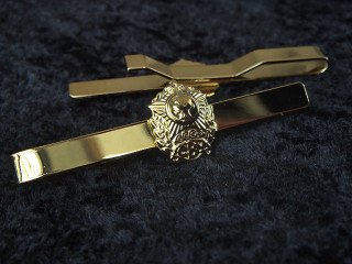 tie clips with the symbolics "SVU"