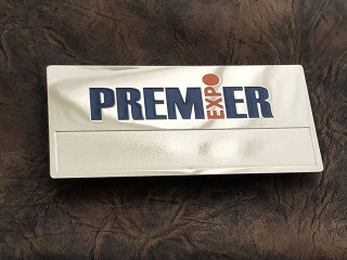 Metal badges with Premier Expo logo
