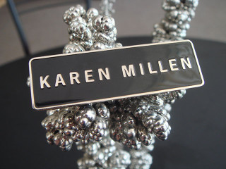 metal badges with the logo "karen millen"