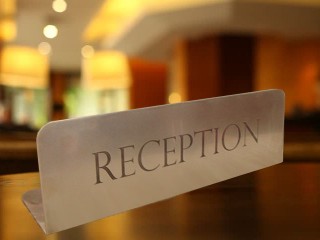 metal plate on the reception desk - "reception"