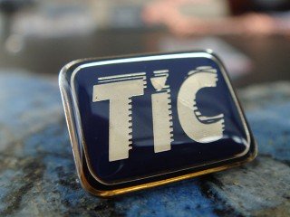 значки з полімером "tic"